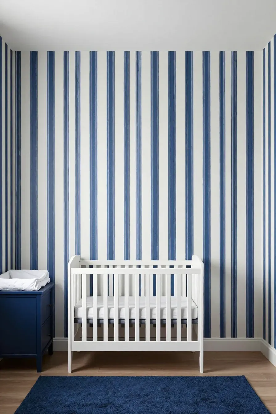 Traditional nursery with vertical blue and white ticking stripe wallpaper and navy accents.