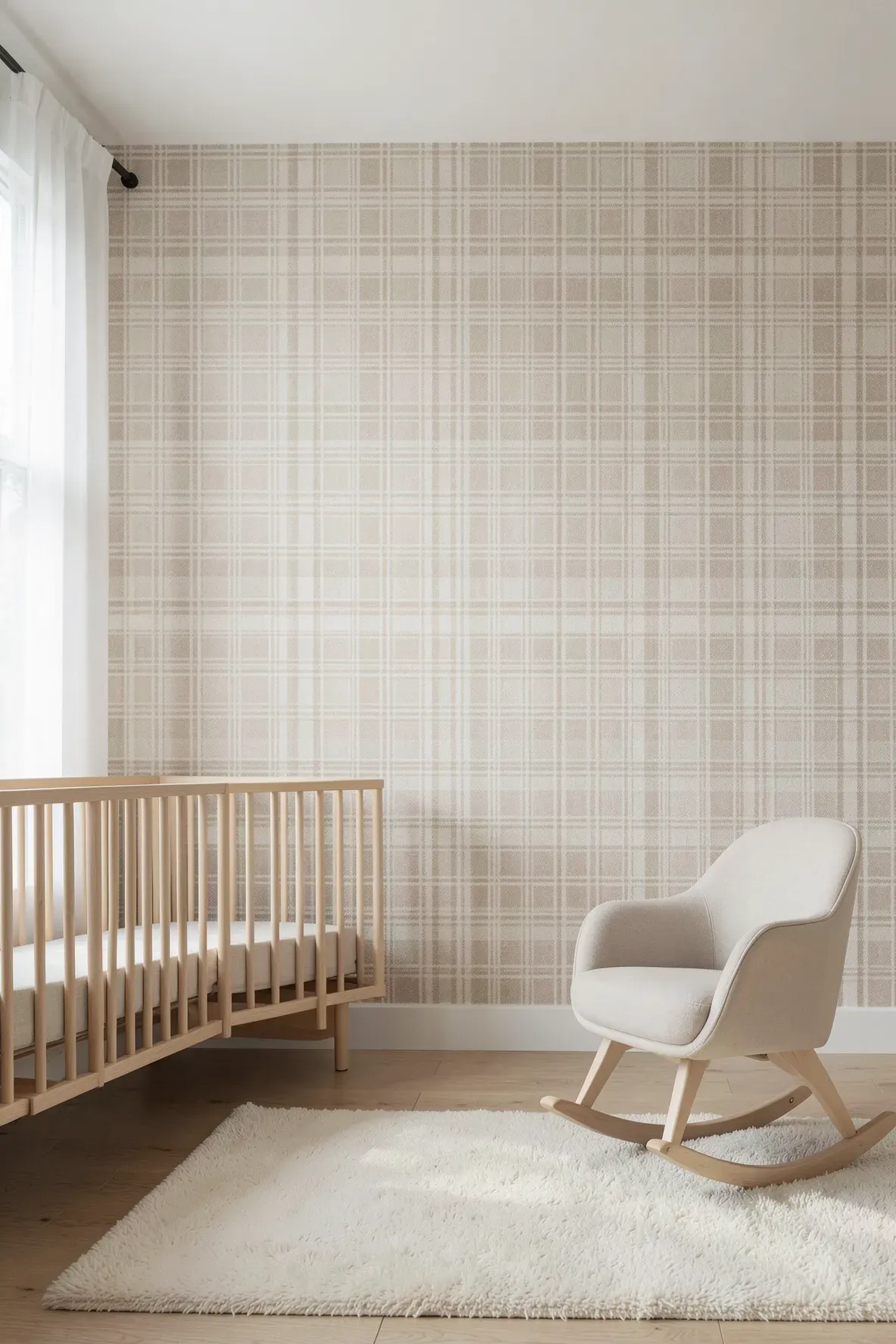 A minimalist nursery with sand-colored plaid wallpaper, a light wood crib, and soft natural light.