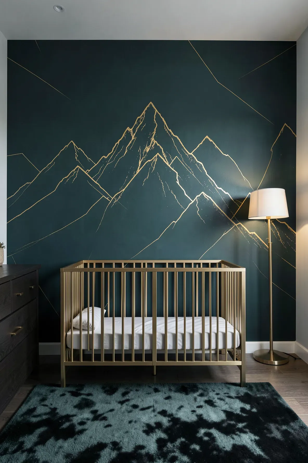 A sophisticated nursery wall with dark teal mountains and geometric gold metallic outlines.