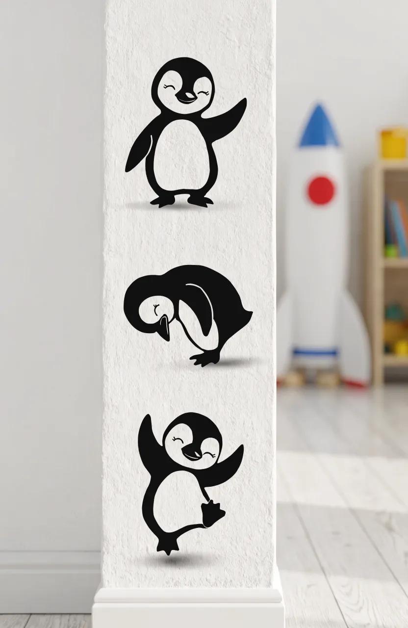 Cute penguin graphics on a nursery wall for a cold-climate theme