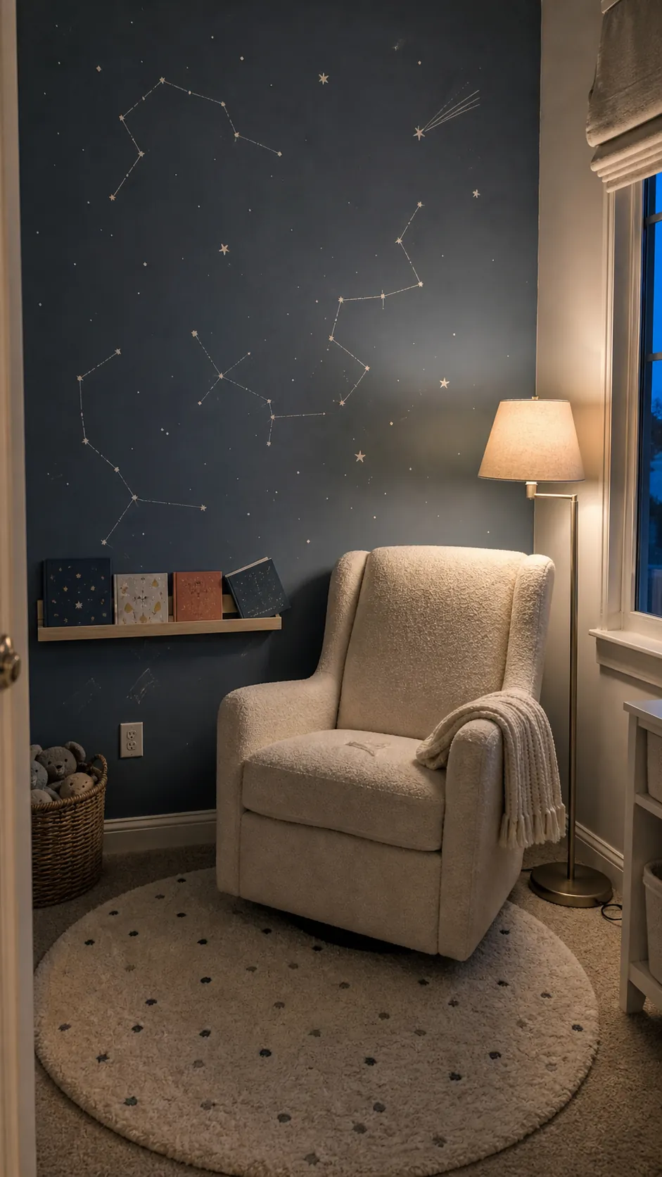 Constellation nursery mural in a small reading nook with chair and books