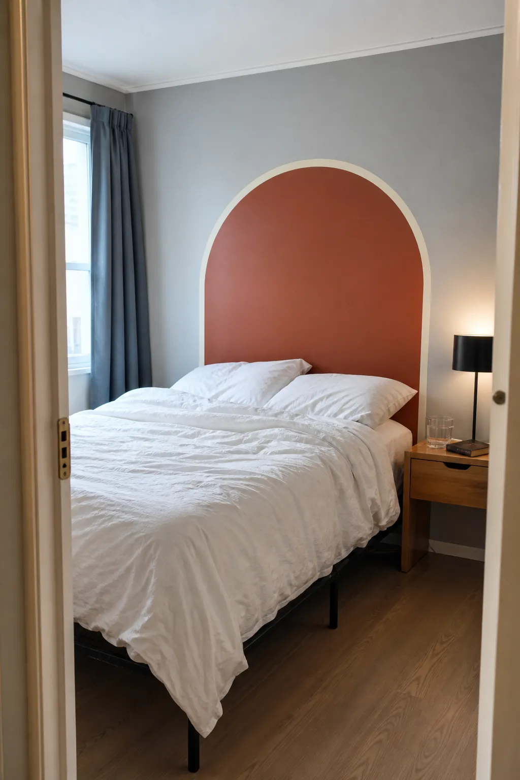 Removable terracotta arch decal used as a renter bedroom headboard