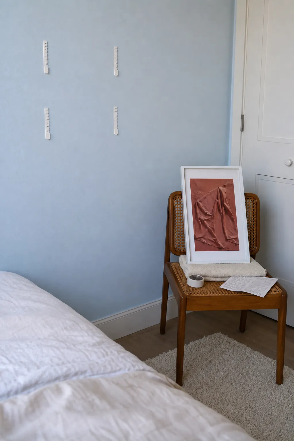 Lightweight frame detached after seating paired picture strips so wall strips can bond