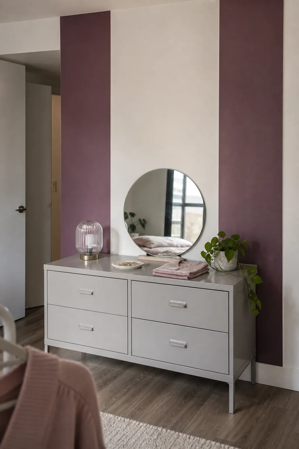 Color-block removable wallpaper columns framing a bedroom dresser