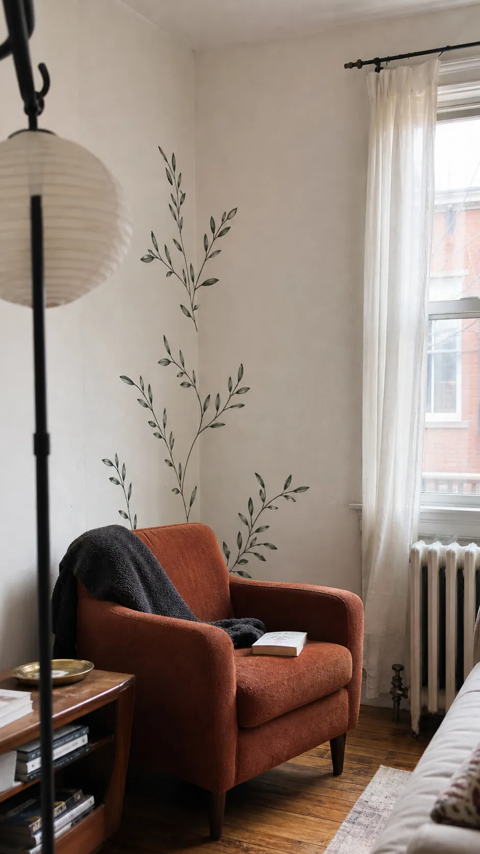 Climbing olive leaf wall decals in a renter-friendly living room