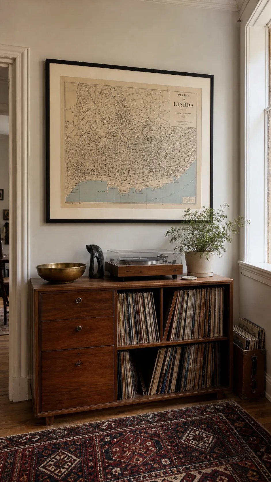 Large framed vintage city map above a walnut living room console