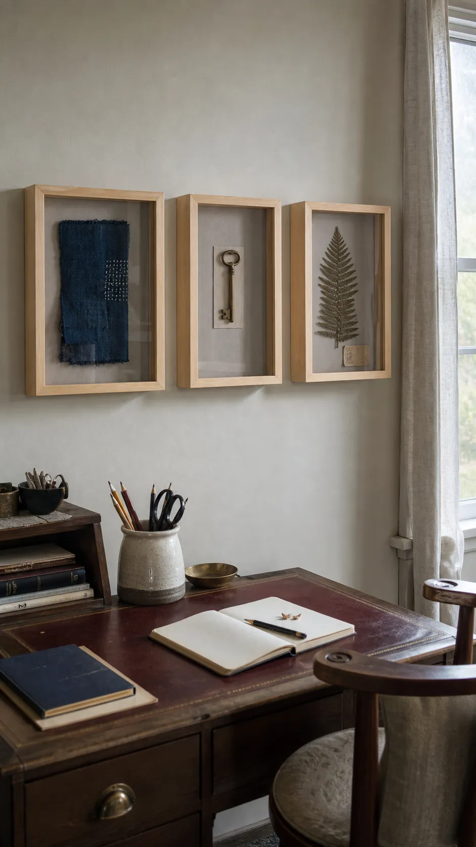 Three shallow shadow boxes displaying meaningful objects in a living room