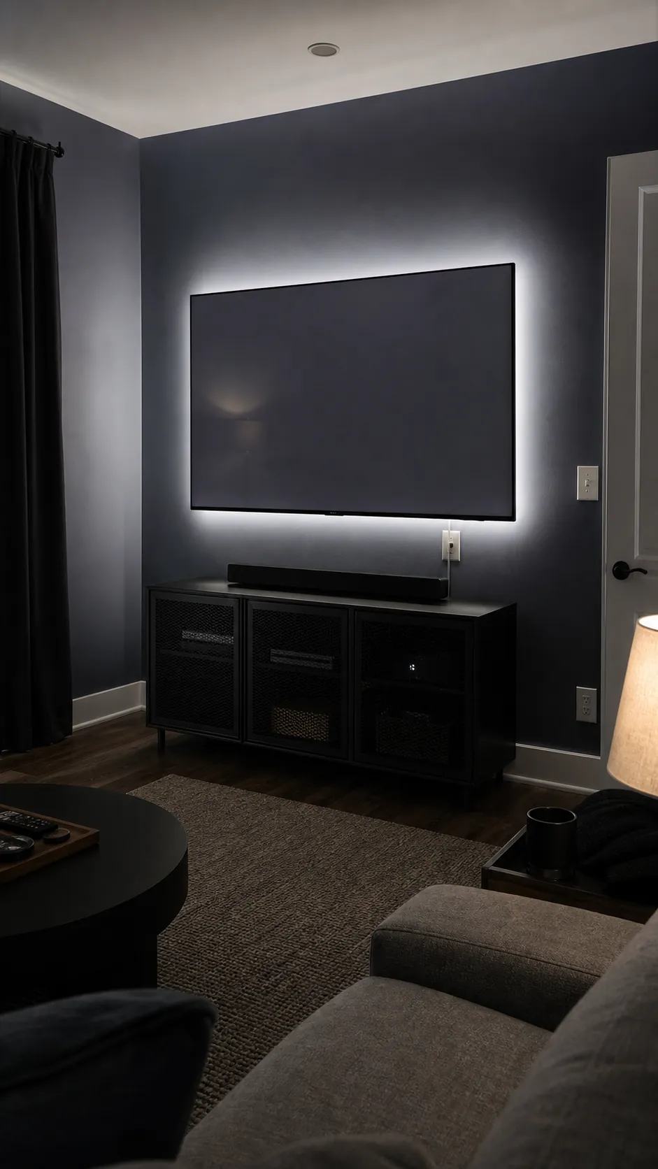 Subtle neutral bias lighting behind a wall-mounted television