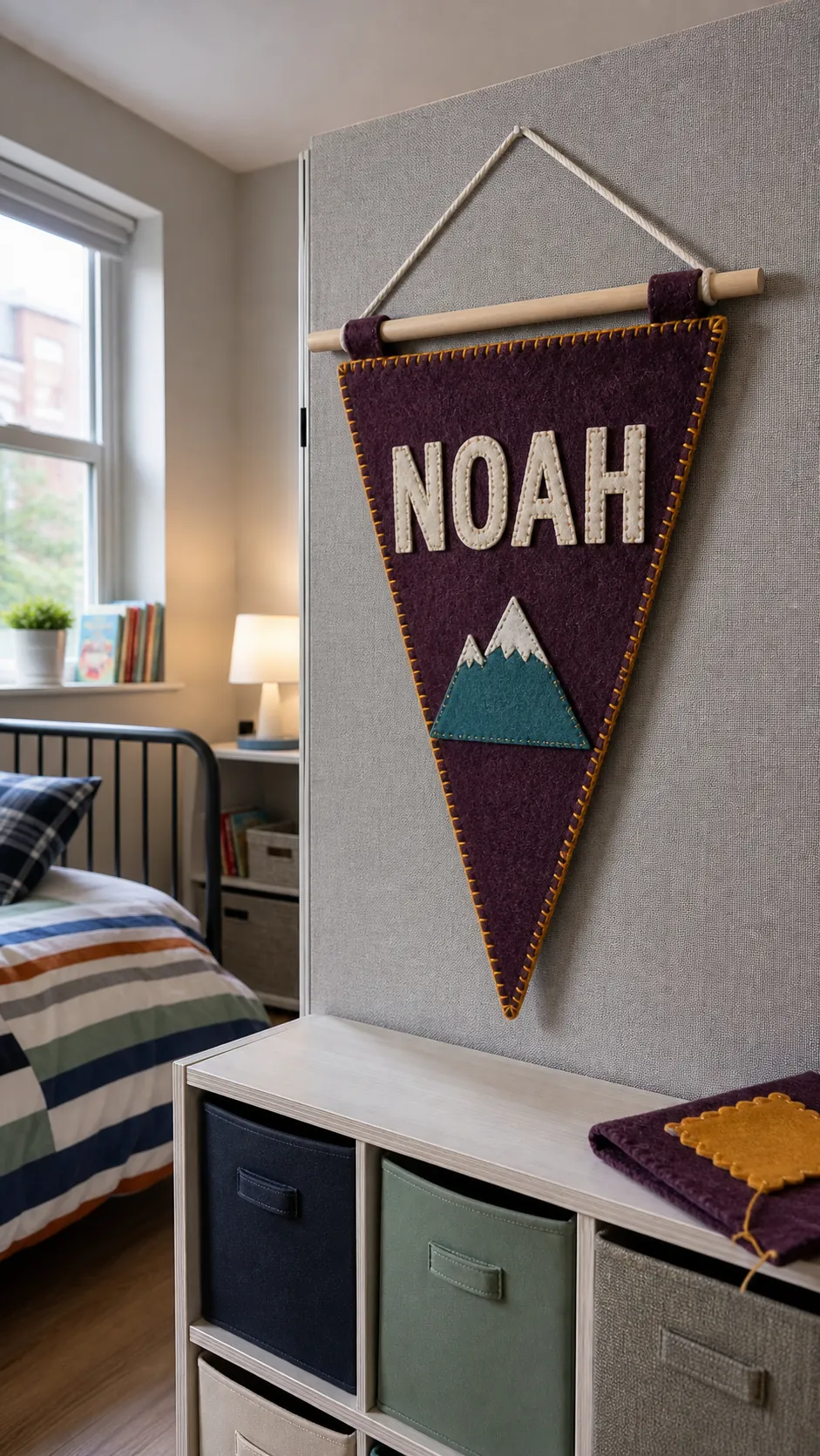 Soft felt name pennant adding personalized decor to a child's room