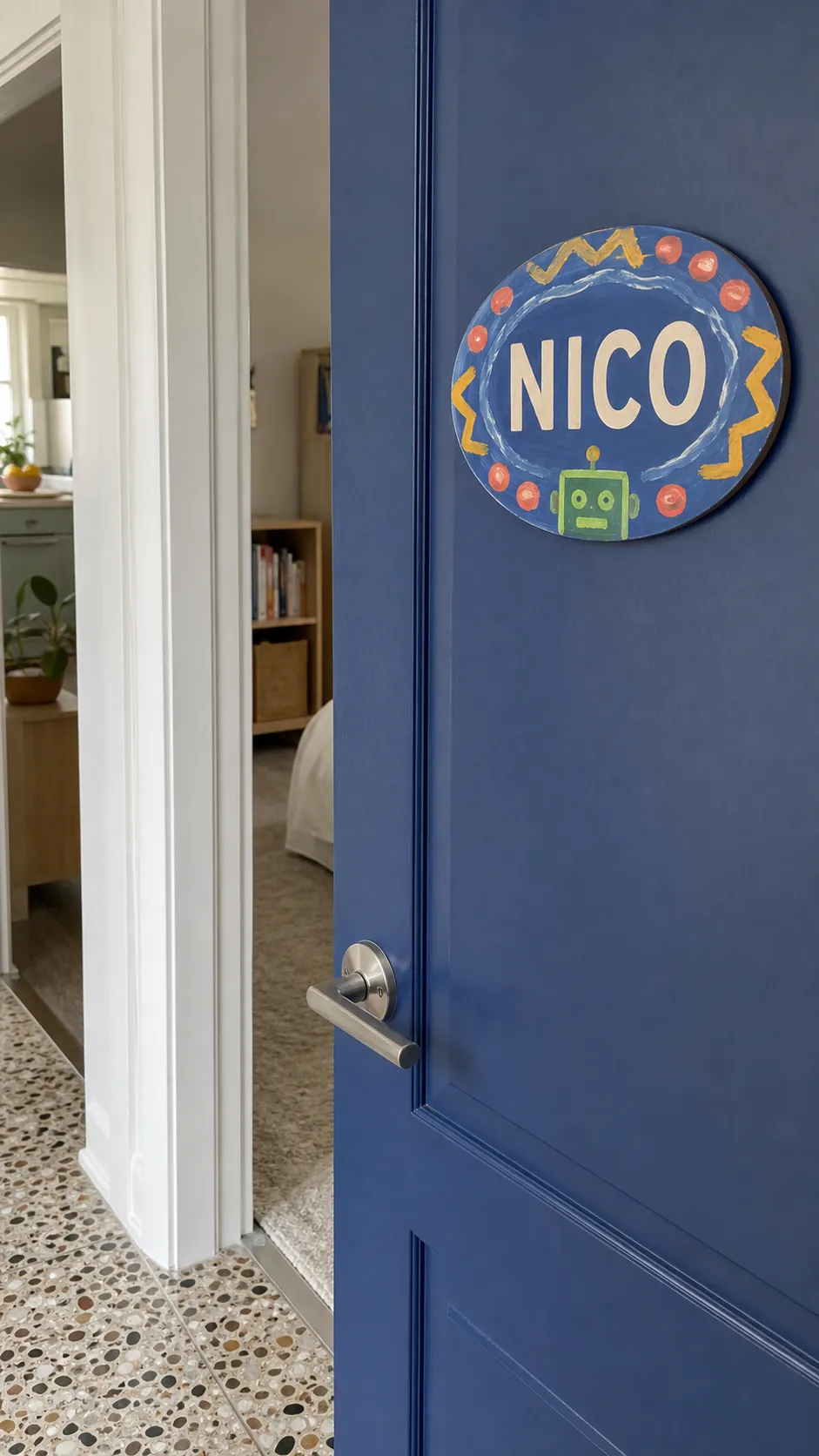 Child-painted bedroom door plaque with a clear first name