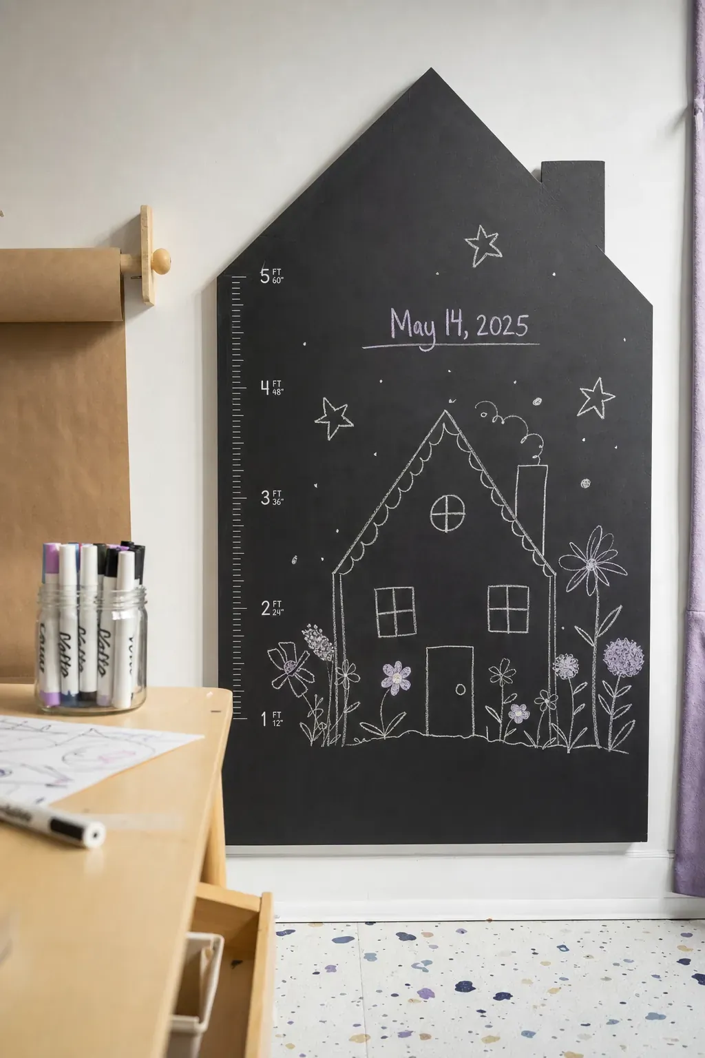 House-shaped chalkboard growth chart with clean measurement lines