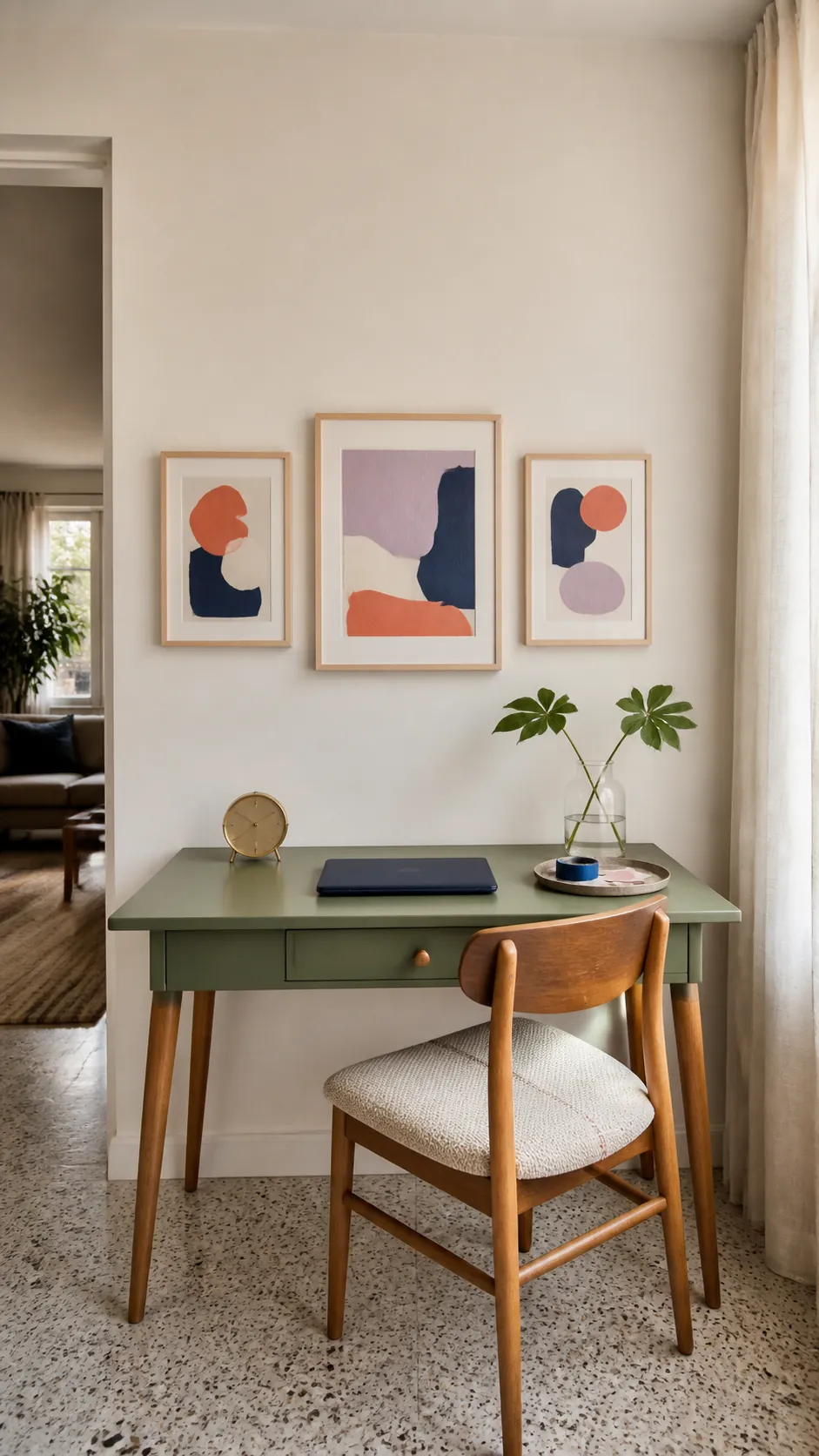 Home office desk with a properly scaled geometric art arrangement