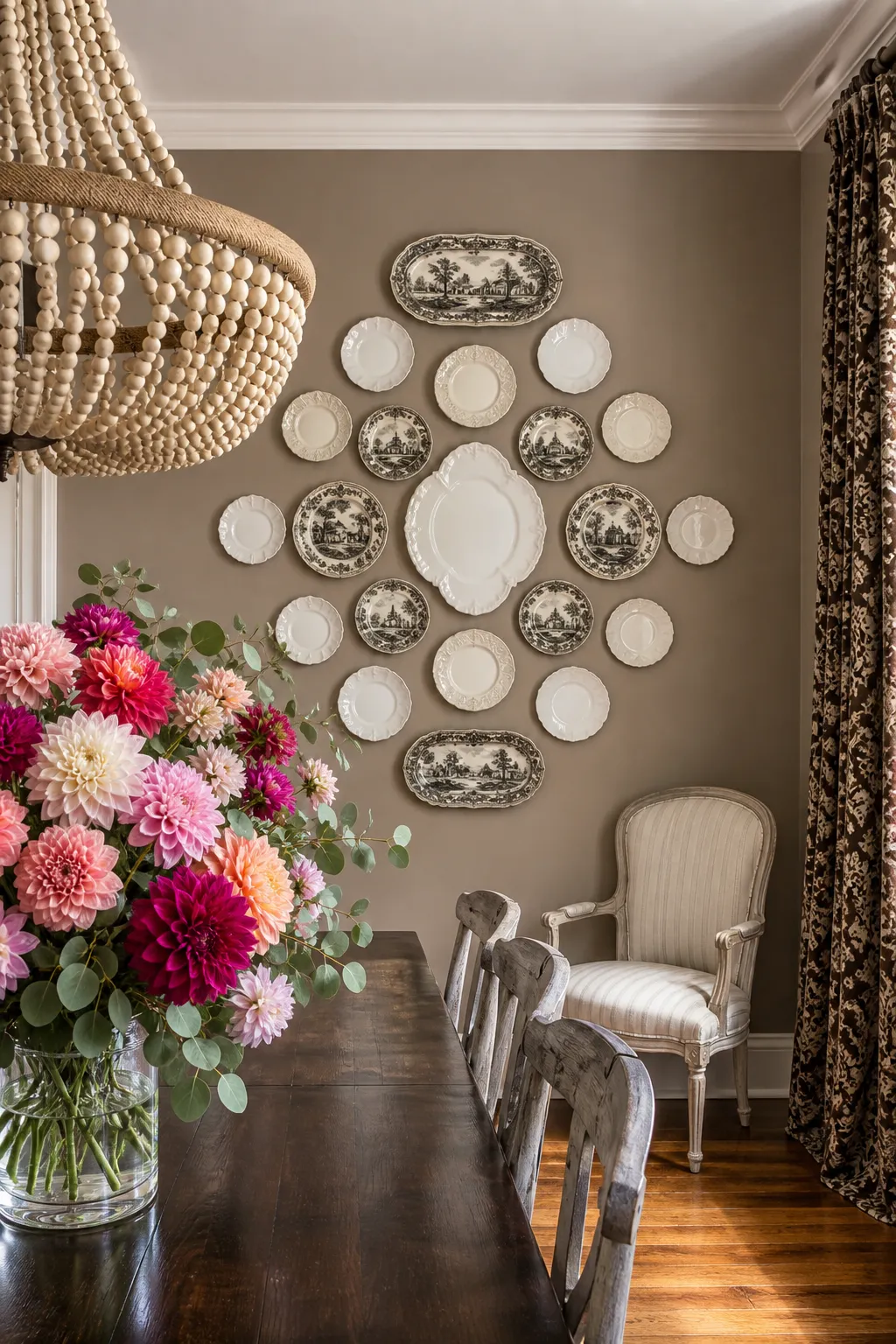 Elegant dining nook with decorative plates arranged symmetrically on the wall