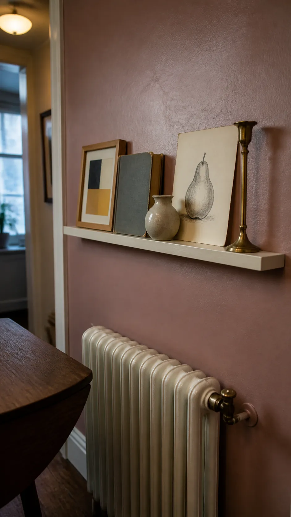 Narrow picture ledge styled with inexpensive blank wall decor