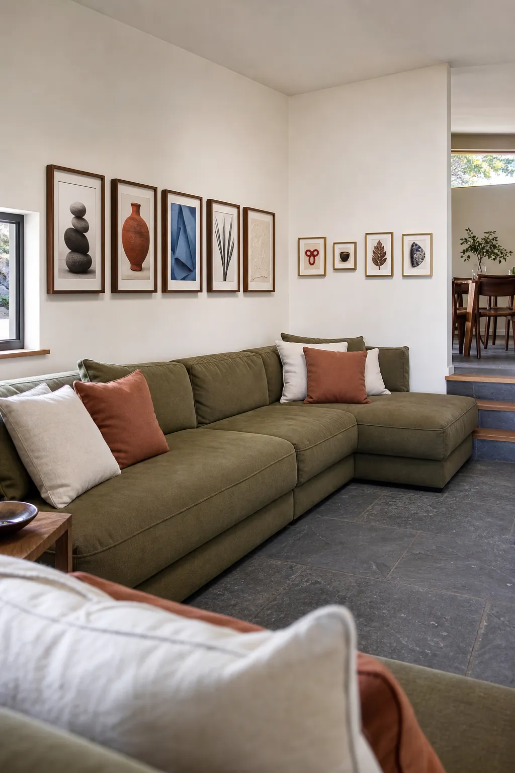 Corner wrapping gallery wall above an L shaped sofa