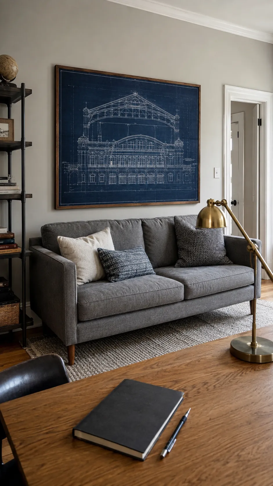 Architectural blueprint display above a tailored gray sofa