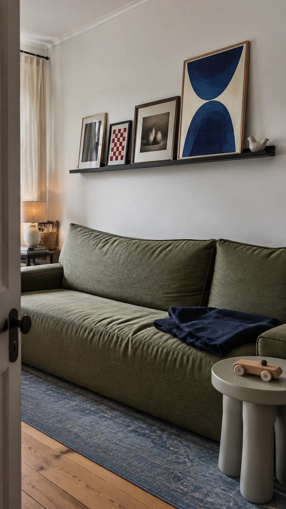 Picture ledge height tested for safe head clearance above a sofa