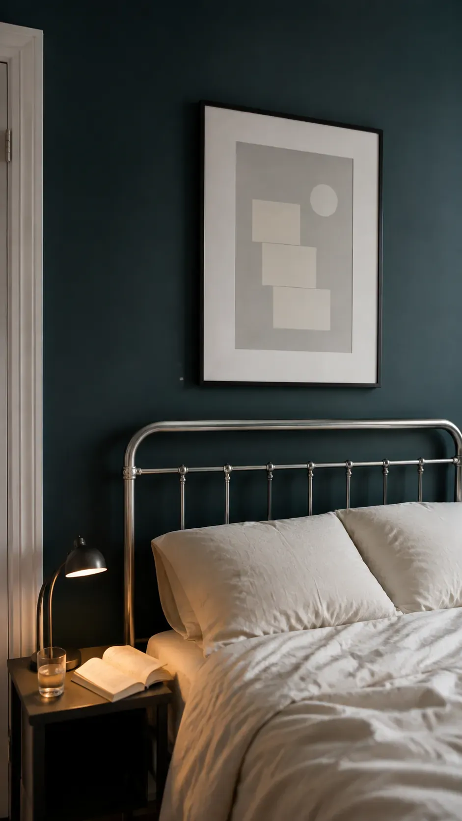 Pale artwork against a deep wall color