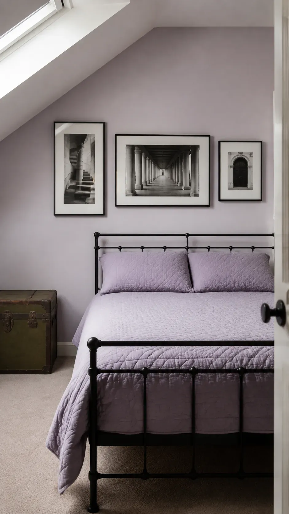 Different sized architectural photographs aligned over a bed