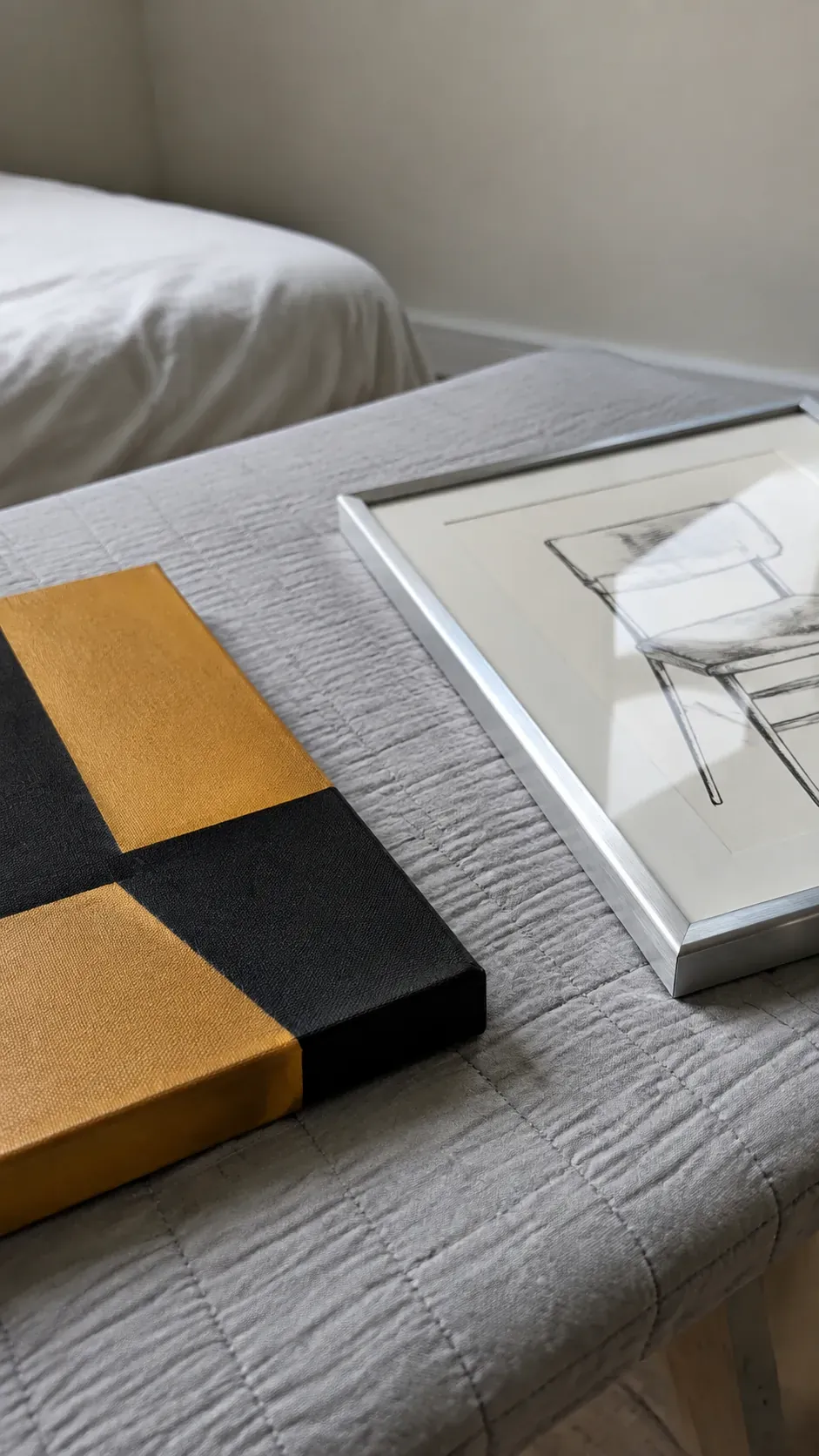 Close view of a canvas edge and a glazed print prepared for comparison