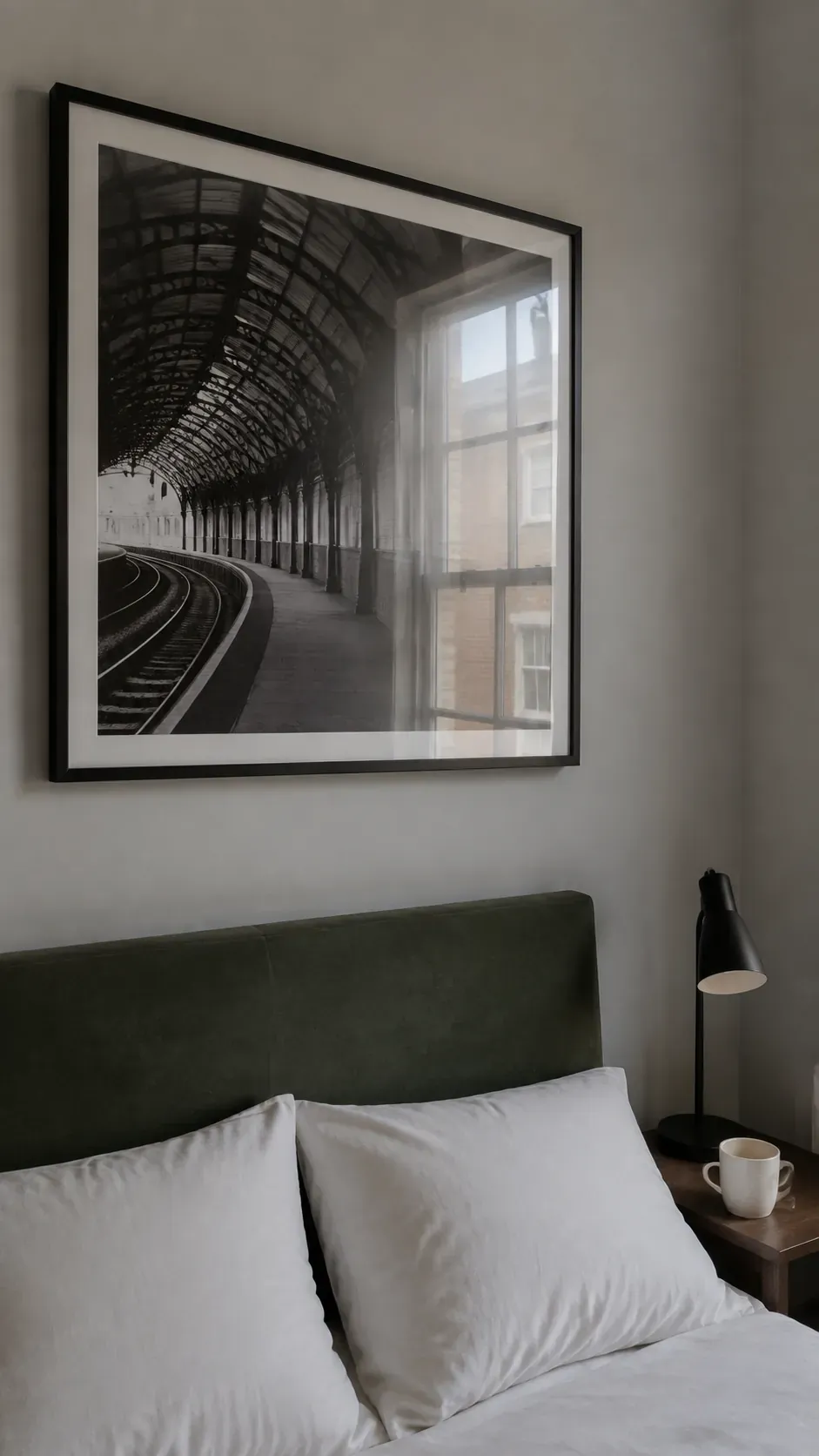 Bedside view showing window reflections on a large framed photograph