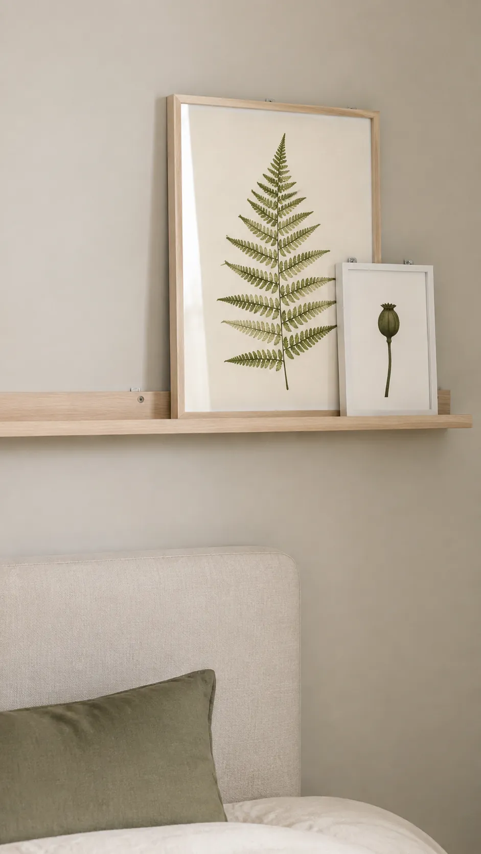 Restrained botanical prints secured on a narrow birch picture ledge