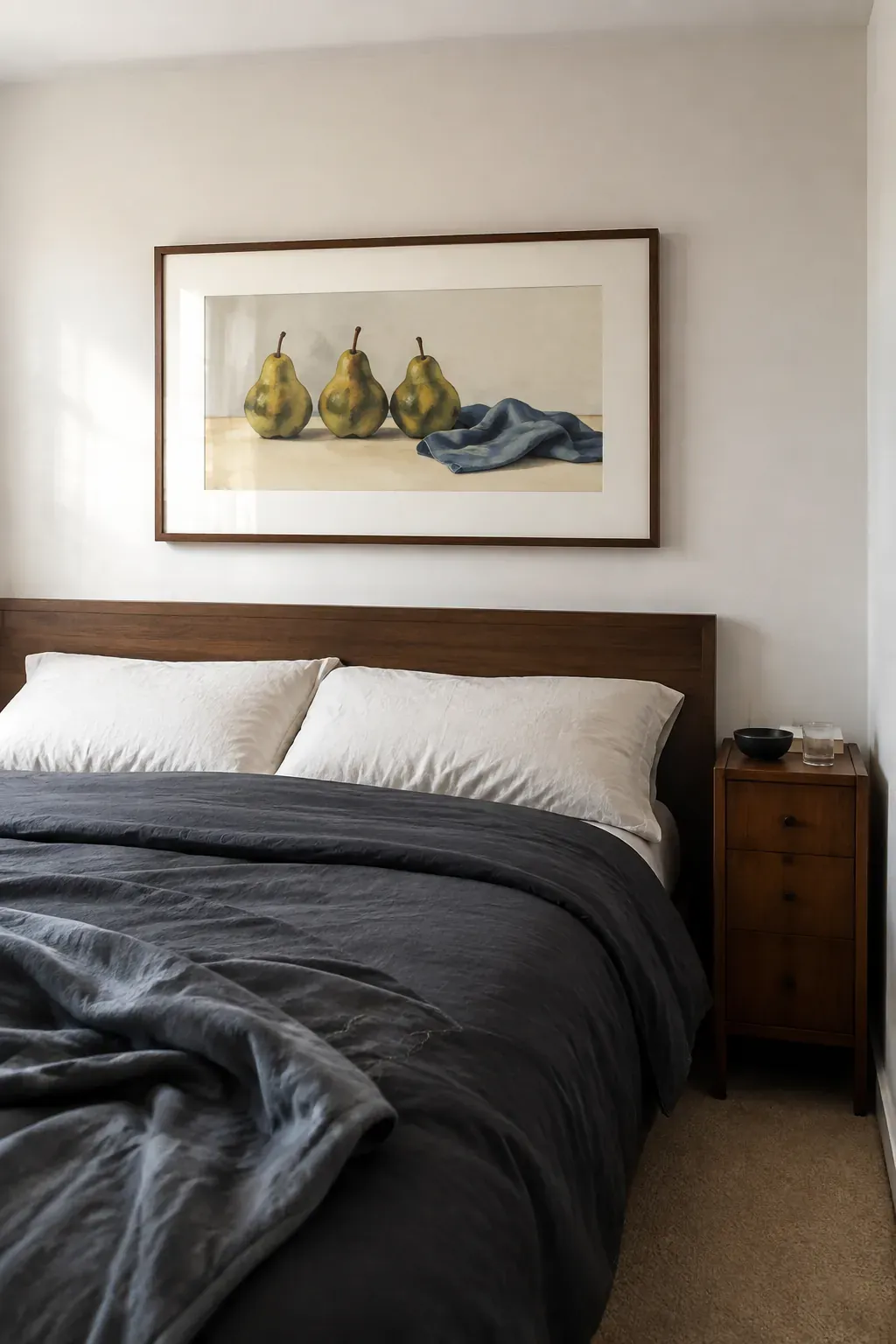 Single horizontal still life print above a walnut king headboard