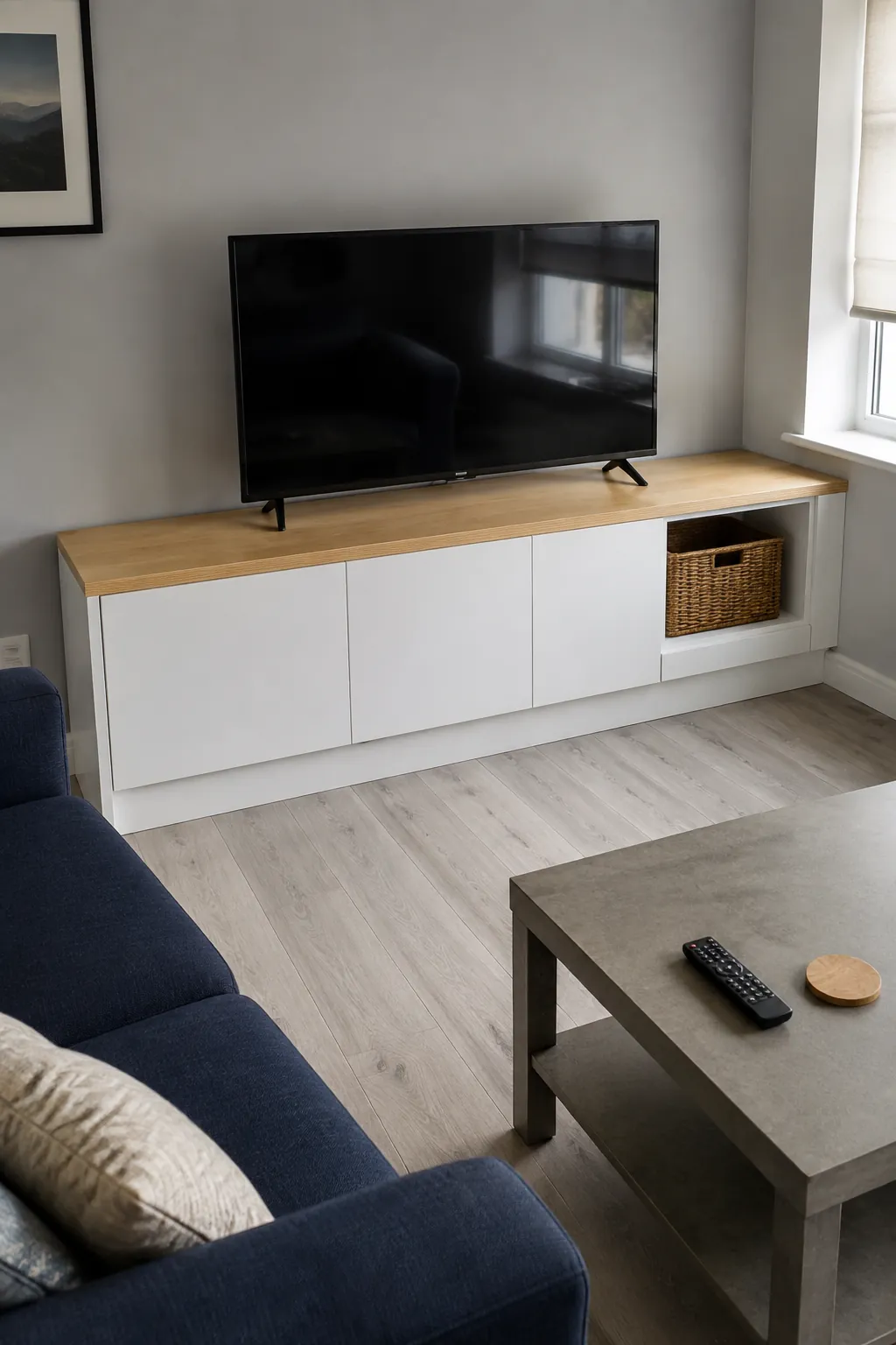Standard cabinets with fitted finishing pieces in a practical built in television wall