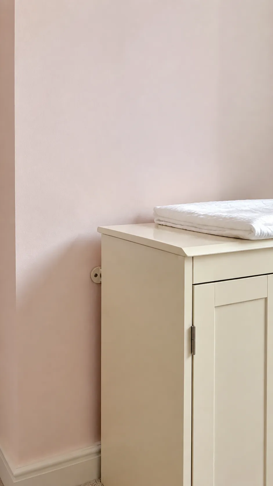Use a barely pink wall with ivory furniture