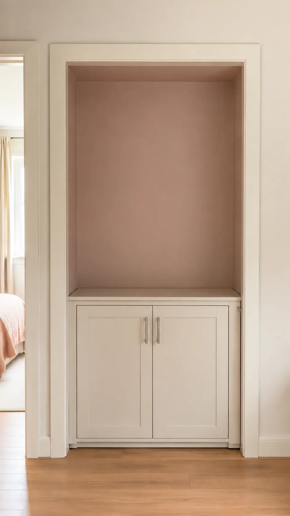 Use warm white trim to sharpen a blush alcove