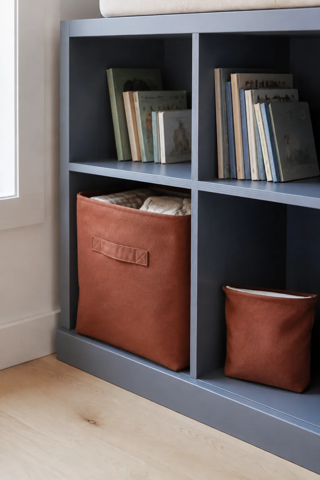 Clay Accents on a Blue Storage Wall nursery color scheme