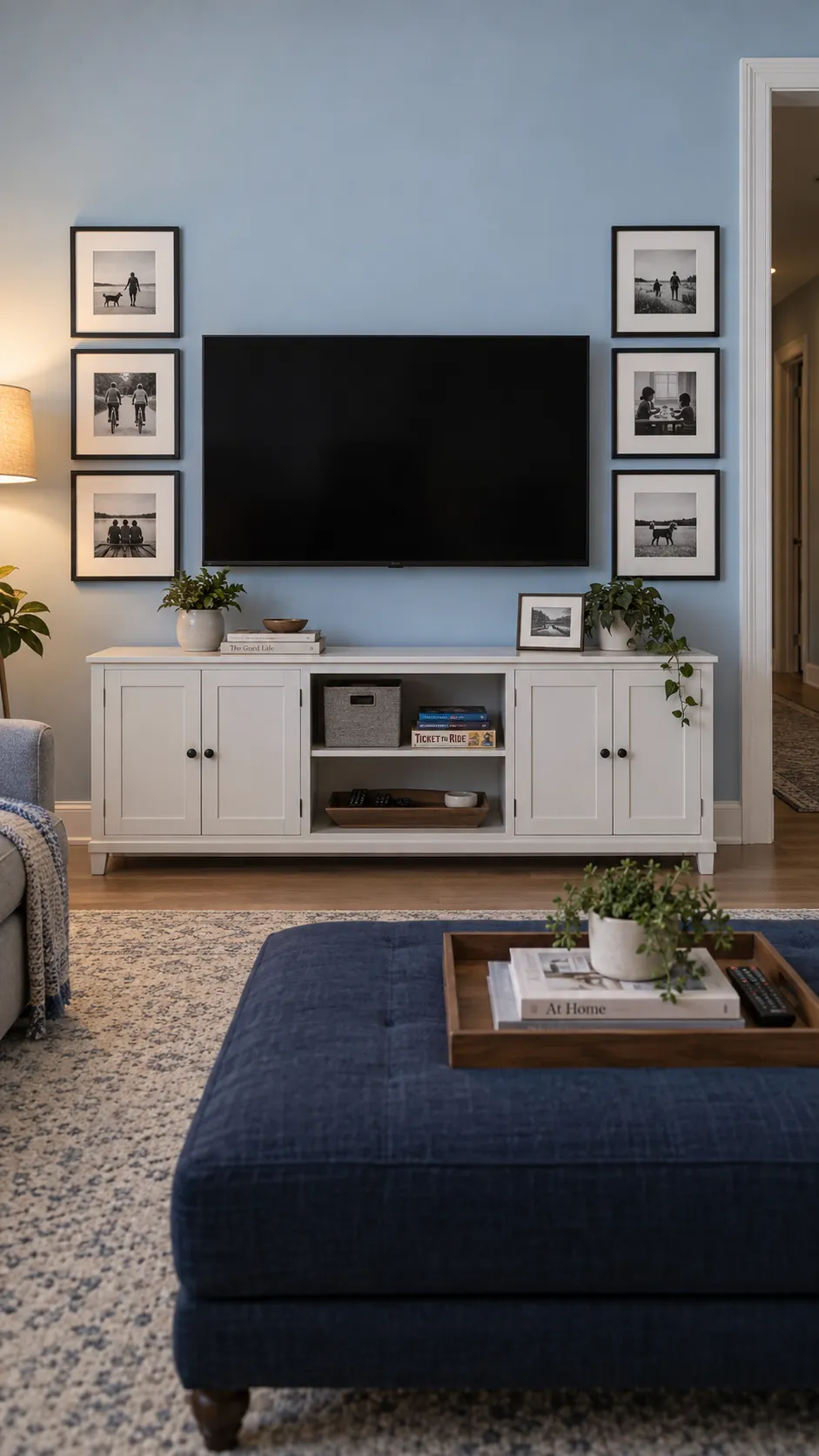 Create a residential photograph showing a thoughtfully edited family photo gallery around a television