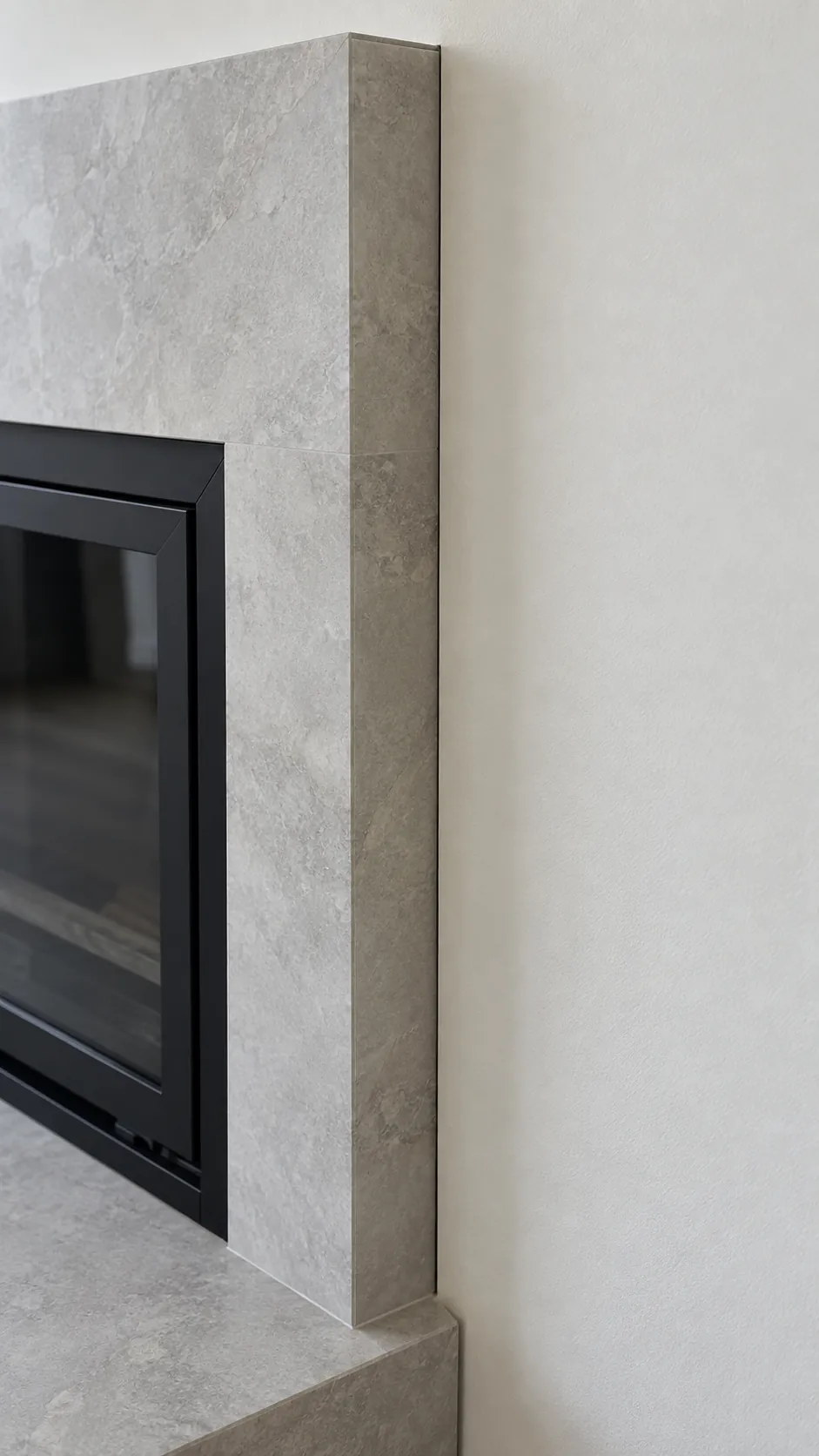 Choose finishes as part of the full assembly when planning a TV wall with a fireplace