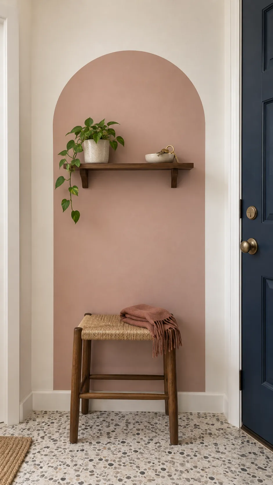 Frame the landing spot with a painted arch in a practical home entryway