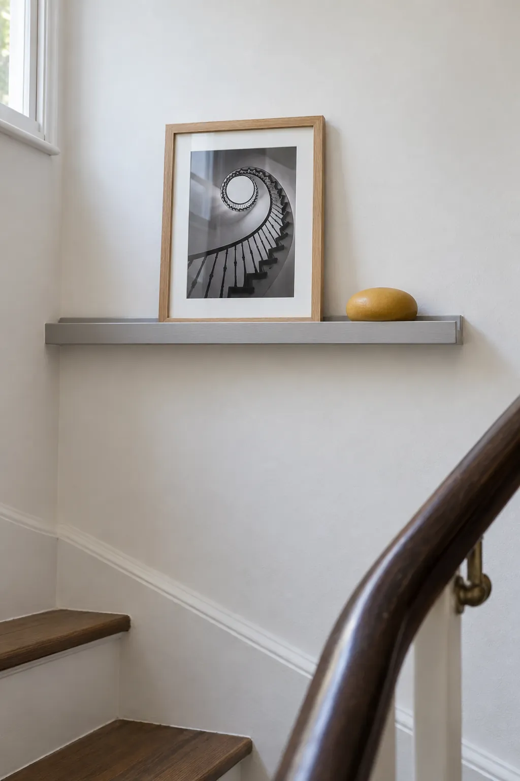 Use a short picture ledge for changing displays in a small home entrance
