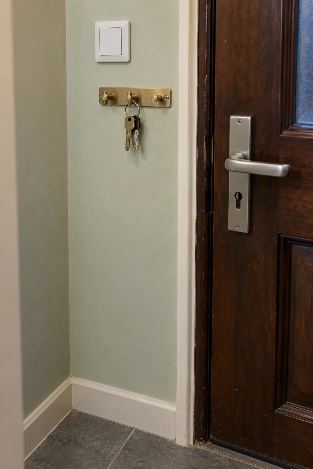 Give the narrow wall beside the door one job in a small home entrance