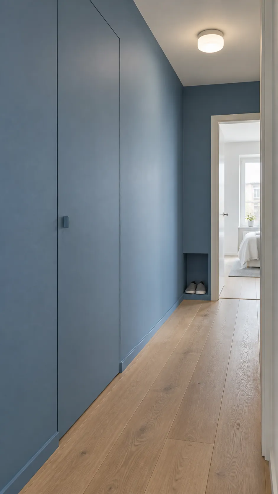 Show how painted color can give a narrow entrance character without adding any projecting decoration