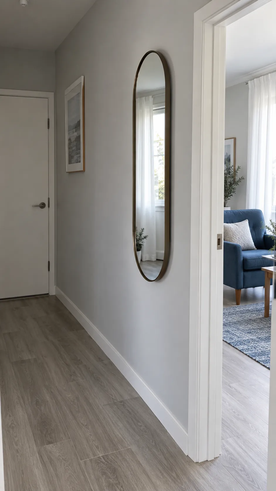 A slim mirror beside the brightest doorway