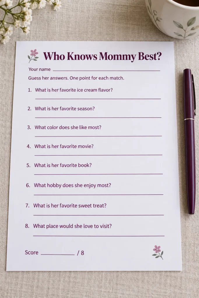 Plum floral Mommy Best quiz sheet and pen ready for a baby shower